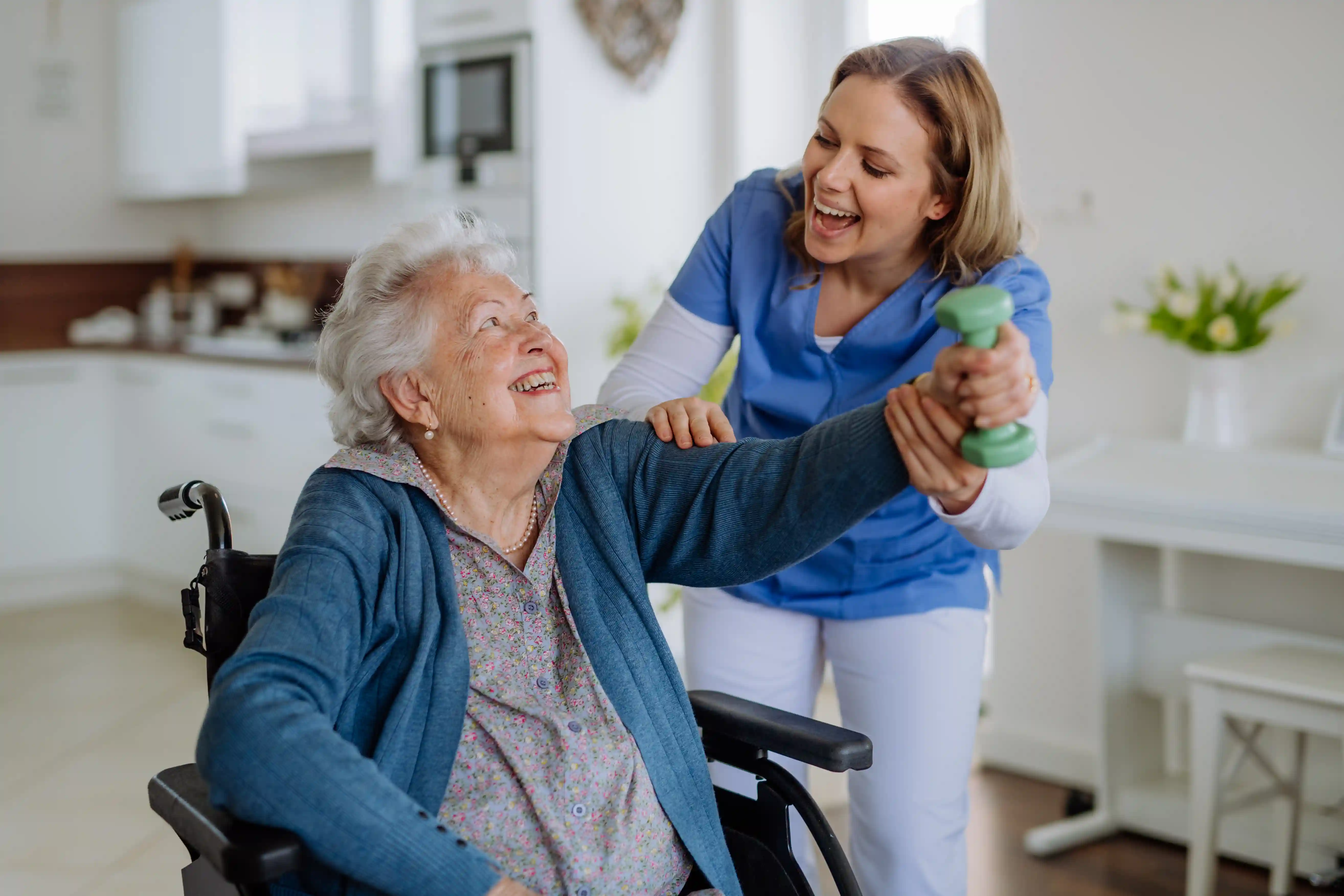 Caregiver leading a wellness session with a senior resident
